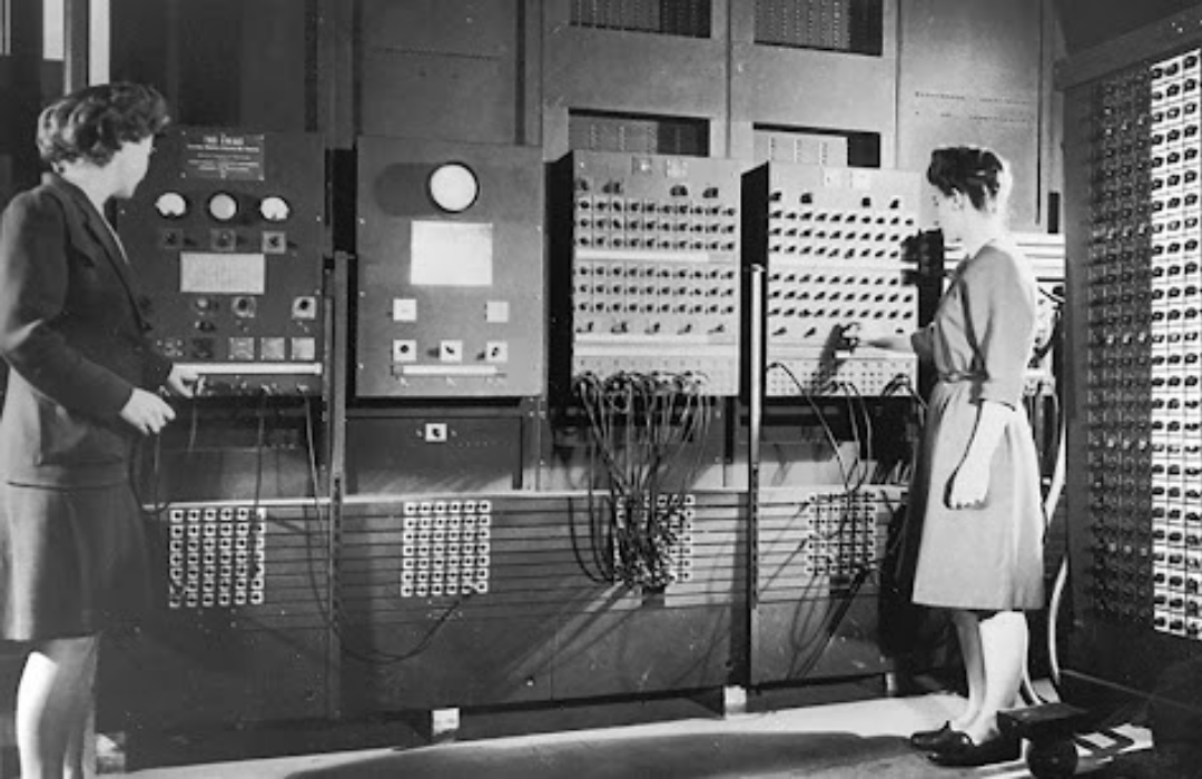 Betty Snyder and Betty Jennings with the first computer